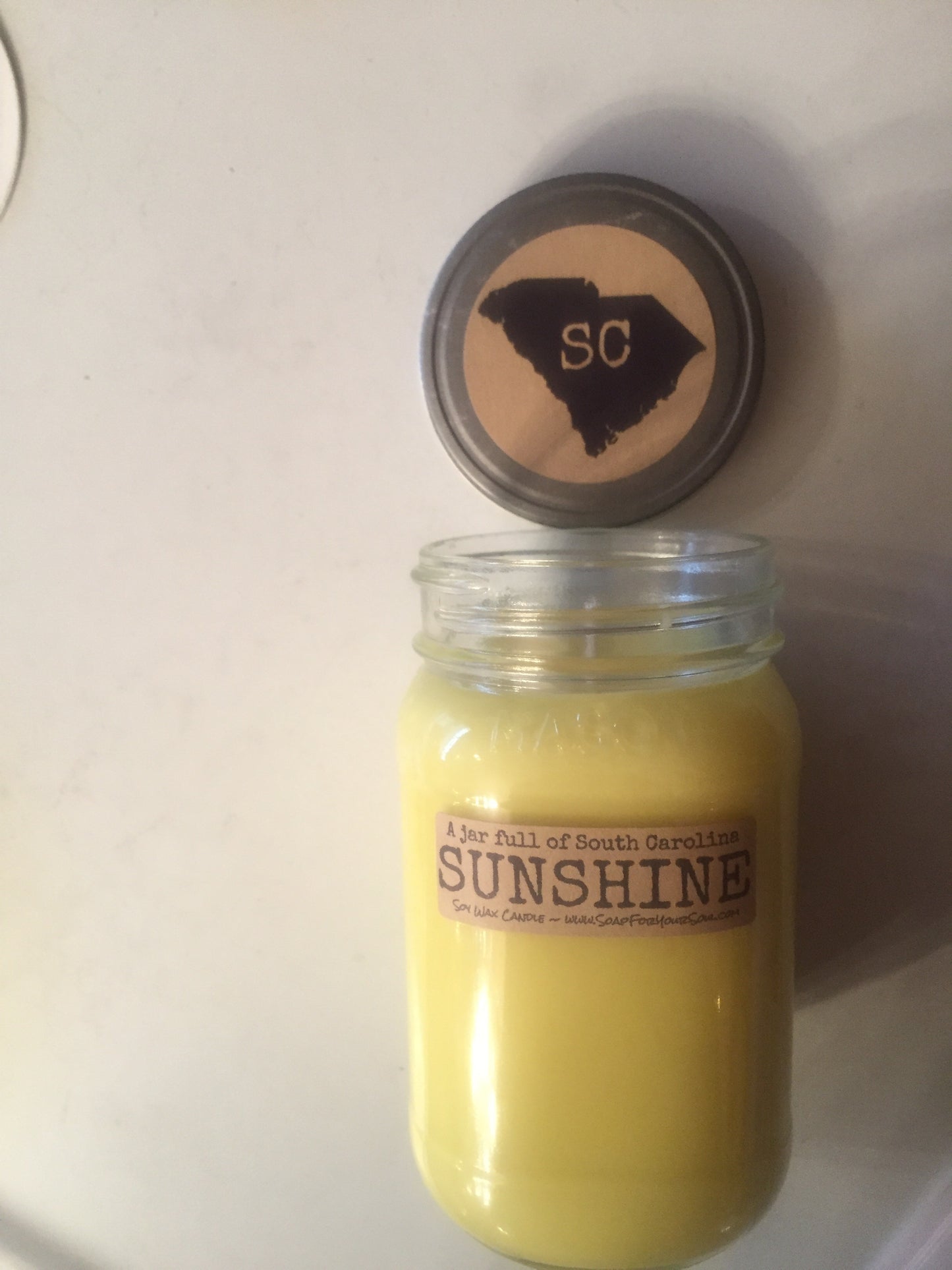 Jar full of South Carolina SUNSHINE soy candle